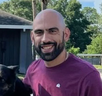 Jorge, expert dog trainer in Jacksonville, FL, with his dog.